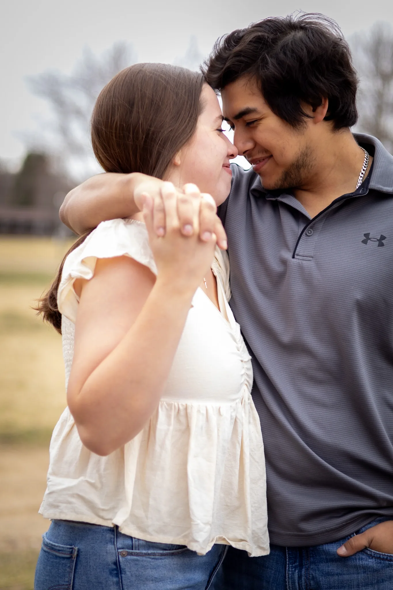 Couple sharing a quiet moment outdoors.
